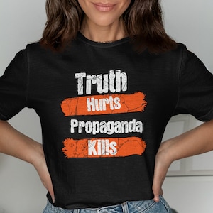 Truth Hurts Propaganda Kills Shirt: Distressed Protest Graphic Tee
