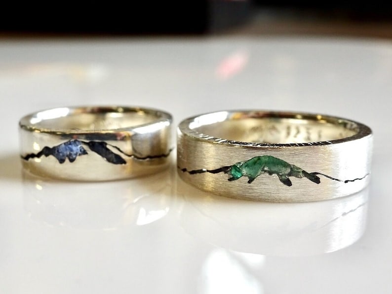 Original personalized Summit Mountain Inlay Rings handcrafted with your choice of recycled material and precious gemstone.   Each personalized mountain ring made to order by Michelle Lenáe Jewelry, original mountain inspired designs in Seattle WA.