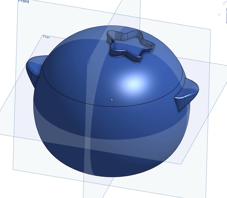 May include: A blue ceramic container with a star-shaped lid. The container is round and has a smooth, glossy finish.