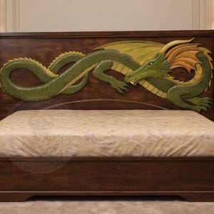 May include: A dark wood bed frame featuring a large, carved green dragon with yellow accents on the headboard. The bed is dressed in a light-colored patterned sheet. Two matching dark wood nightstands are positioned on either side of the bed.