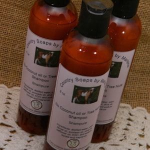 May include: Three amber shampoo bottles with black lids and white labels. The labels read "Country Soaps by Marlene" and "No Coconut oil or Tree Nuts Shampoo." The bottles are 237 ml.