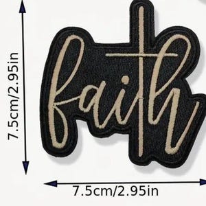 May include: A black embroidered patch with the word "faith" in a cursive font, with a cross integrated into the "t". The patch measures 2.95 inches by 2.95 inches.