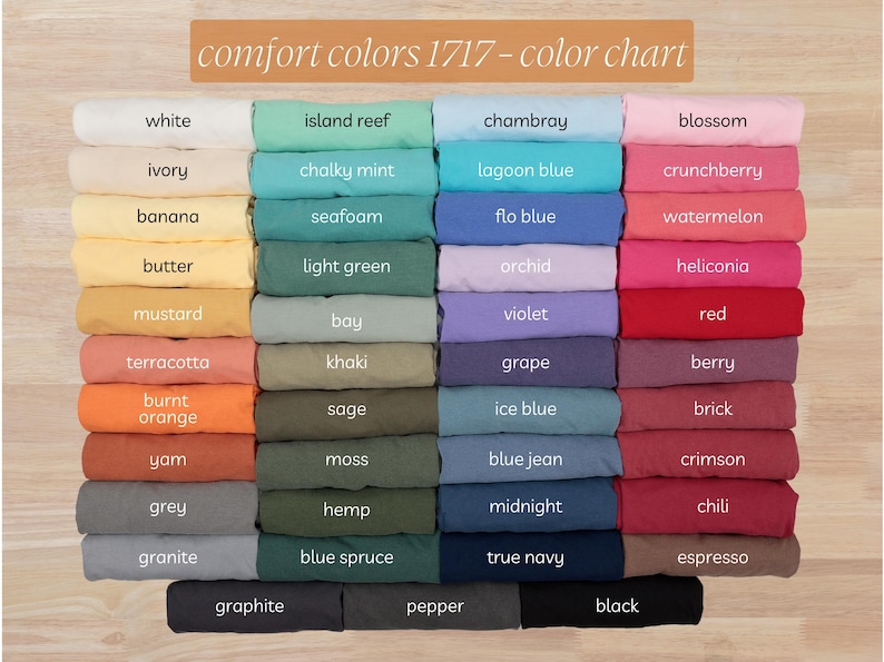 以下が含まれることがあります： Comfort Colors 1717のカラーチャート。さまざまな生地の色が並んでいます。白、アイボリー、バナナ、バターなどの色合いが表示され、アイランドリーフ、シャンブレー、ブロッサムなども含まれています。「comfort colors 1717 - color chart」の文字が上部にあります。