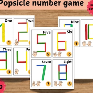 May include: Printable number game for kids featuring colorful popsicle stick numbers 1-10. Each number is made with popsicle sticks and has a corresponding hand sign.