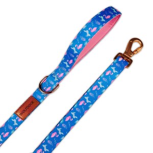 May include: A blue and pink dog leash with a flamingo print and a gold metal clasp. The leash has a brown leather patch with the text "WOLFDOG" on it.
