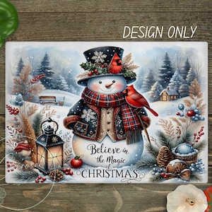 May include: A rectangular winter-themed design featuring a snowman with a top hat, scarf, and jacket, surrounded by a snowy landscape and cardinals. The text "Believe in the Magic of CHRISTMAS" is displayed. The words "DESIGN ONLY" are also displayed.