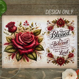 May include: A rectangular design featuring a large, detailed red rose with green leaves and the text "Blessed is the Believed". The design includes floral accents and the words "DESIGN ONLY".