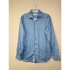 May include: A light blue long-sleeved button-down shirt with a white and light blue striped inner collar.