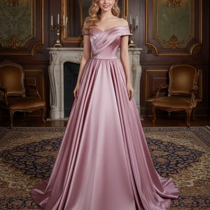 Könnte beinhalten: Ein bodenlanges Abendkleid in zartem Rosé mit Off-Shoulder-Ausschnitt. Das Kleid hat ein gefaltetes Oberteil und einen weiten Rock aus Satin. Der Stoff fällt elegant und erzeugt eine klassische Silhouette. Geeignet für besondere Anlässe.