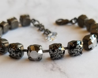 Black patina and silver chrome adjustable swarovski crystal tennis bracelet with jewel charm