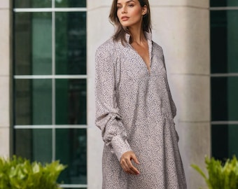 Beige Polka Dot Midi Dress with V-Neckline, Cuffed Pleated Sleeves, Pockets, and Loose Fit – Elegant Outfit for Casual and Formal Occasions