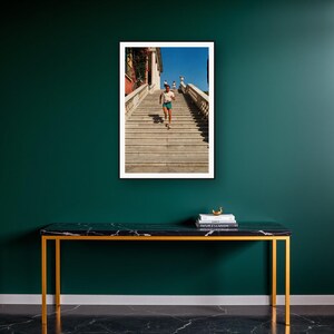 Stair Running Wall Art art print on a brass and black console vignette
