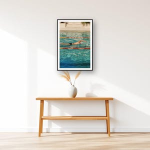 Swimmer Wall Art art print displayed above an entry console table