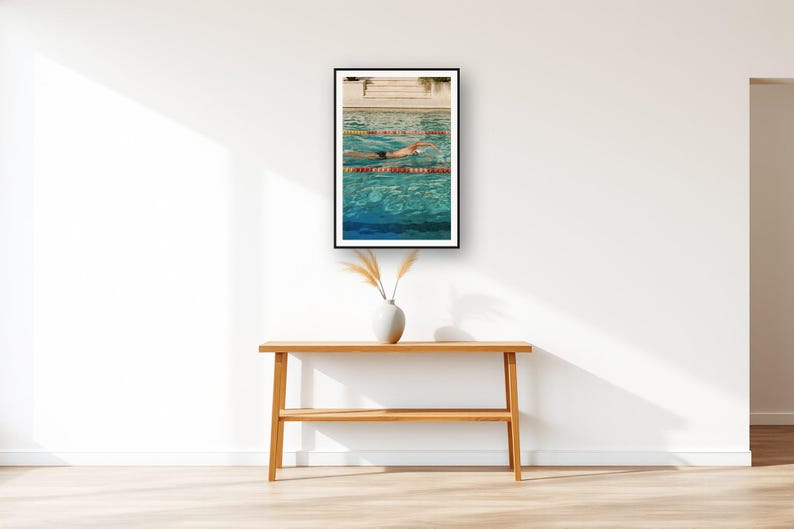 Swimmer Wall Art art print displayed above an entry console table