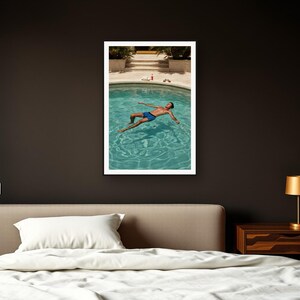 Pool Float Wall Art art print framed in a dark luxury bedroom