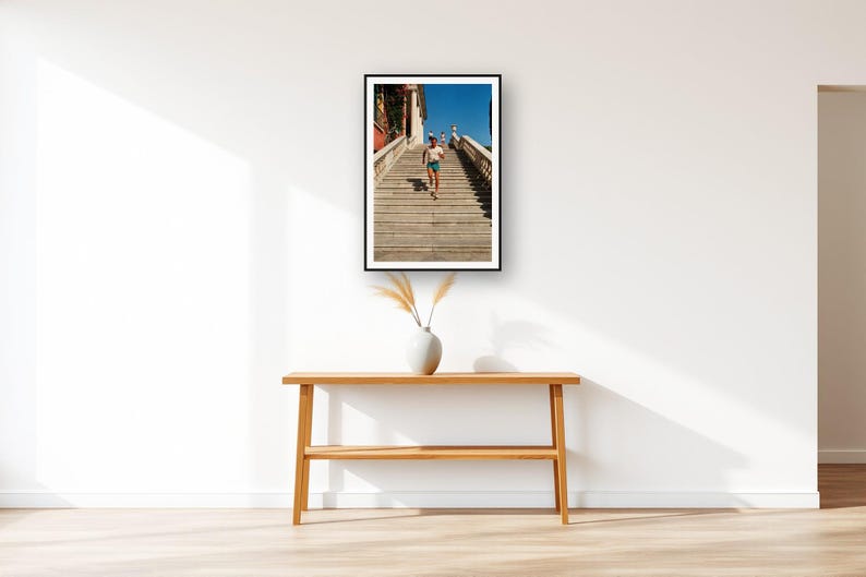 Stair Running Wall Art art print displayed above an entry console table