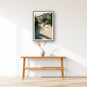 Sled Push Wall Art art print displayed above an entry console table