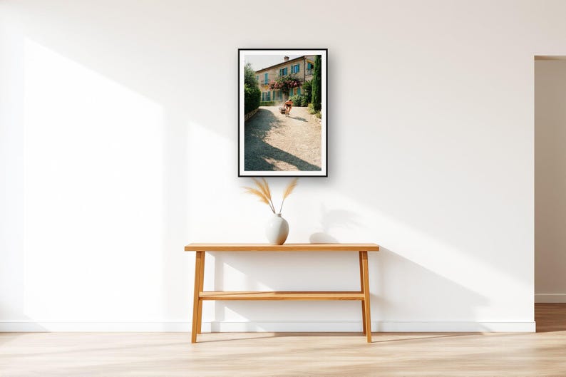 Sled Push Wall Art art print displayed above an entry console table