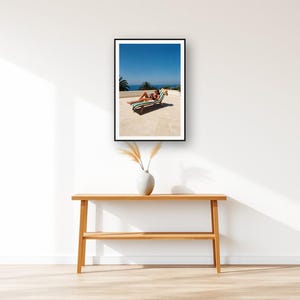 Sun Lounger Wall Art art print displayed above an entry console table