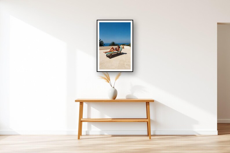 Sun Lounger Wall Art art print displayed above an entry console table