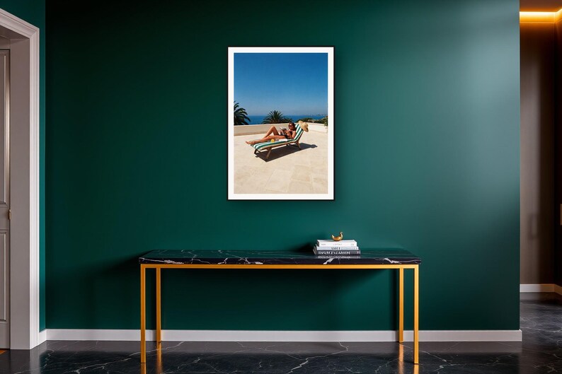 Sun Lounger Wall Art art print on a brass and black console vignette