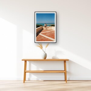 Athlete Stretching Wall Art art print displayed above an entry console table