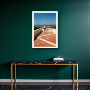 Athlete Stretching Wall Art art print on a brass and black console vignette