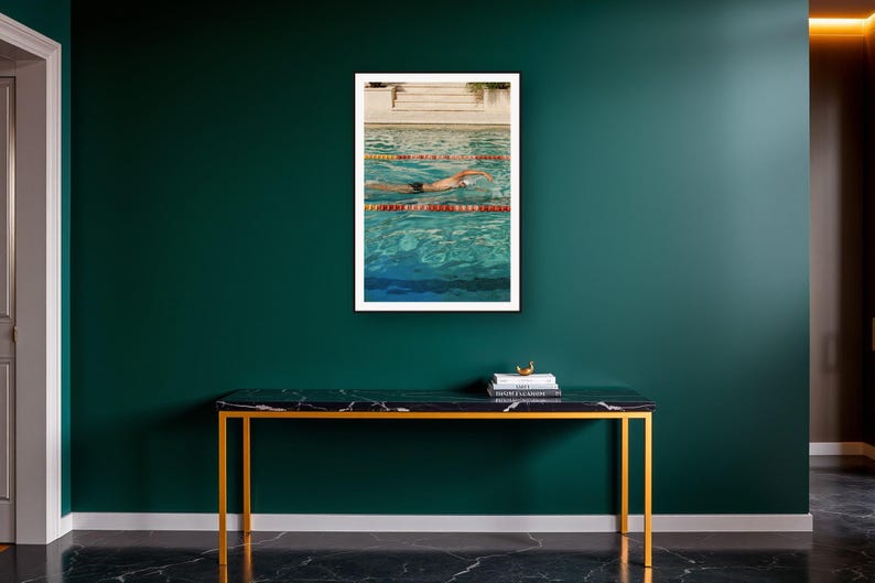 Swimmer Wall Art art print on a brass and black console vignette