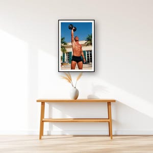 Dumbbell Press Wall Art art print displayed above an entry console table