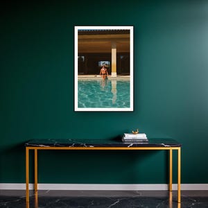 Poolside Athlete Wall Art art print on a brass and black console vignette