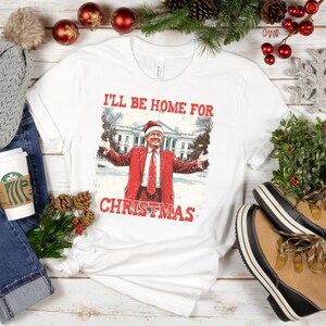 Donald Trump I&#39;ll Be Home For Christmas T-Shirt | Political Trump Holiday Shirt | Festive MAGA Supporter Tee | Republican Gift Apparel