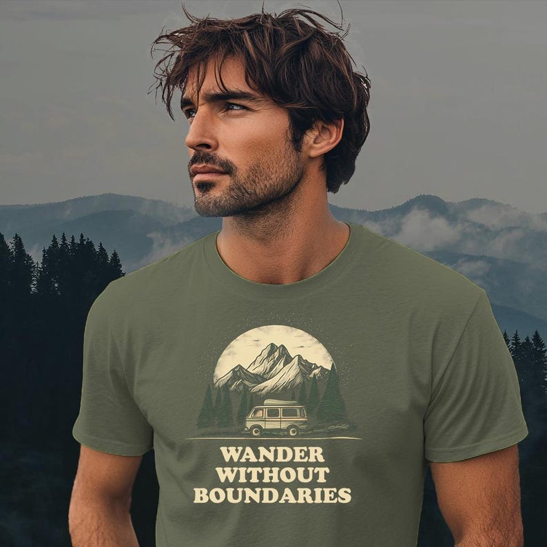 May include: A green t-shirt with a vintage-style illustration of a van driving through a mountain landscape. The text "WANDER WITHOUT BOUNDARIES" is printed below the illustration.