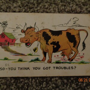 Vintage Postcard with 2 cent stamp written on
