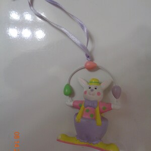 1991 Avon Easter Ornament Bunny tossing eggs