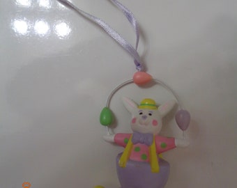 1991 Avon Easter Ornament Bunny tossing eggs