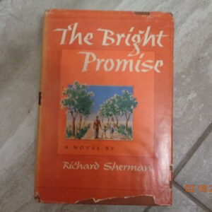 May include: The cover of a vintage paperback book titled "The Bright Promise" by Richard Sherman. The cover features a colorful illustration of a family walking down a path lined with trees.