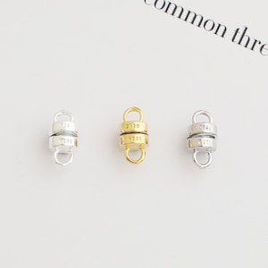 May include: Three magnetic clasps for jewelry making. The clasps are made of metal and are available in silver, gold, and rose gold.