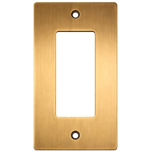 May include: A rectangular, brushed brass-colored wall plate with a single rectangular opening. Two small, circular holes are positioned at the top and bottom. The plate has a smooth, metallic finish and is designed for electrical fixtures.