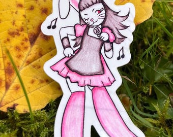 May include: A sticker featuring a cartoon character with bunny ears, a pink dress, and pink leg warmers. The character is winking and surrounded by musical notes. The sticker is set against a backdrop of green grass and a yellow leaf.