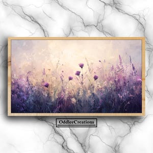 May include: A framed floral print featuring a field of purple and lavender flowers. The artwork has a soft, impressionistic style with a light background. The frame is made of light-colored wood. The text "OddleeCreations" is at the bottom.