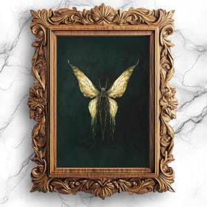 May include: A gold butterfly with intricate details is framed in a dark wood frame with ornate carvings. The butterfly is set against a dark green background.