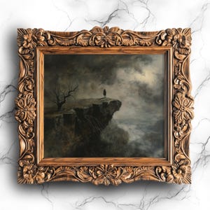 May include: A framed painting depicting a lone figure standing on a cliff overlooking a misty landscape. The sky is dark and stormy, with a single moon visible in the distance. The painting is framed in a dark wood frame with ornate carvings.