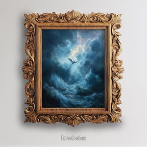 May include: An artwork in a gold-coloured ornate wooden frame, depicting a dragon flying through a stormy sky above waves. The artwork's colours are predominantly blue and white. The text "OddleeCreations" is at the bottom.