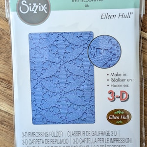 May include: A set of three ceramic mugs with a speckled, matte finish. Each mug features a different color: light blue, cream, and gray. The mugs have a simple, modern design and a comfortable handle.