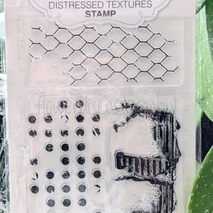 May include: A set of three ceramic mugs with a speckled, matte finish. Each mug features a different color: light blue, cream, and gray. The mugs have a simple, modern design with a rounded shape and a comfortable handle.