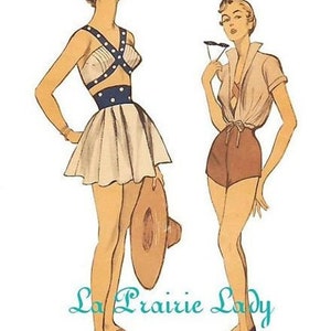 May include: Two women wearing vintage 1950s style swimwear. The woman on the left is wearing a white and blue swimsuit with a skirt. The woman on the right is wearing a white shirt with a brown skirt. The text "La Prairie Lady" is visible in the bottom centre of the image.