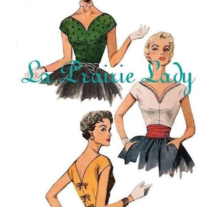May include: Three vintage sewing patterns for women's tops. The patterns are from La Prairie Lady and feature different necklines and sleeve styles. The tops are shown on three different models.