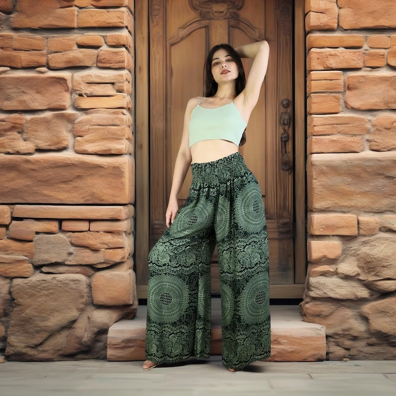 May include: A woman wearing a light green crop top and wide-legged pants with a black and green mandala print. The pants have an elastic waistband and a flowing silhouette.