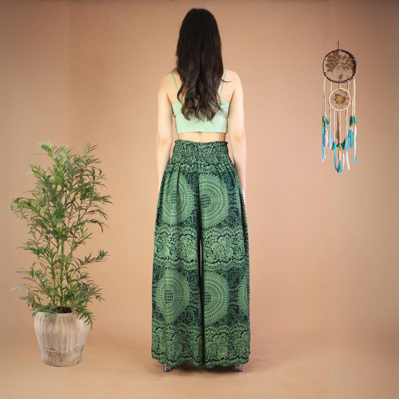 May include: Green wide-leg pants with a mandala print. The pants have an elastic waistband and a flowing silhouette.