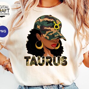 May include: A white t-shirt with a camouflage print of the word "Taurus" and a black woman wearing a camouflage hat with a yellow bull symbol.